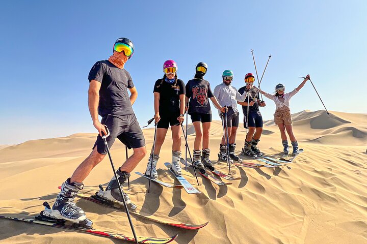 De ultieme sandboard- en sandski-ervaring, zonsondergang, buggy en kampvuur!